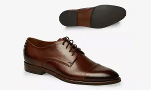 Eleganckie, brązowe półbuty męskie z zaokrąglonym noskiem i ozdobnym przeszyciem. Idealne, by dopełnić stylizację z garniturem.